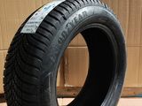 a close up of a tire on a cardboard box with a cardboard box in the background
