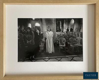 black and white photograph of a man and a woman standing in a church