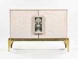 an image of a white cabinet with gold legs and a black and white design on the door