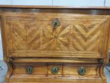 an old wooden chest with two drawers on it