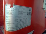 a close up of a sign on a red machine