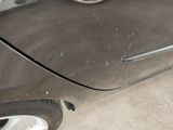 a close up of a car door handle with a sticker on it