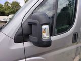 an image of a side view mirror of a van