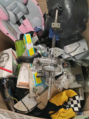 a cardboard box filled with assorted items in a room