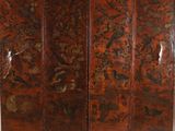 an old wooden room divider with a floral design on it