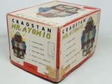 a box with a robot inside of it on a white surface