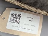a tag on a pillow with a tag attached to it