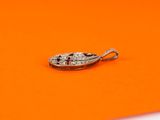 a small diamond ring on an orange surface