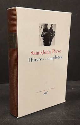 the book is sitting on a table with a black background