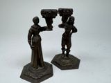 pair of antique bronze figurines of two women holding vases
