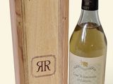 a bottle of wine sitting next to a wooden box