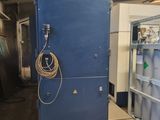 an image of a large blue refrigerator in a warehouse