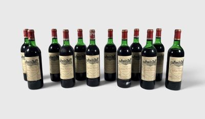 six bottles of wine are lined up in a row on a white surface