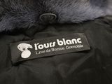 a close up of a black jacket with a fur collar