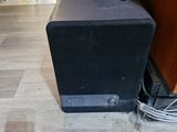a speaker that is sitting on the floor in the room