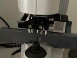 a close up of a microscope that is on a table
