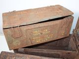 several old metal boxes are stacked on top of each other