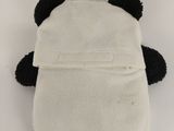 white and black stuffed panda bear sitting on top of a white table