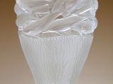 a glass vase that is sitting on a table