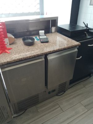 an image of a kitchen counter with a phone on top of it