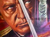 movie poster of a man holding a sword in front of a woman