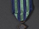 purple, green and blue ribbon with a cross on it