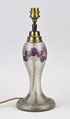 an image of a glass lamp with a purple flower on it
