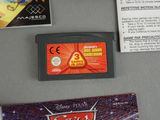 a nintendo game and a card sitting on a table