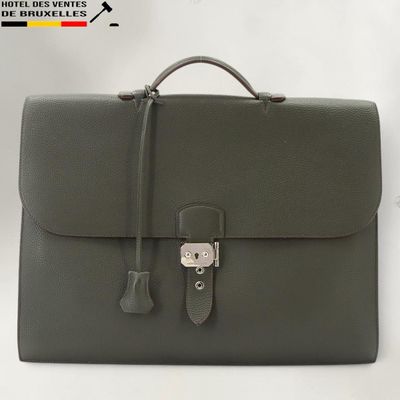 a close up of a briefcase on a table with a white background