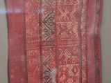 a red and black cloth with a pattern on it