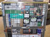 a metal cart with many items in it in a warehouse