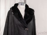 an image of a coat with a fur collar on a mannequin