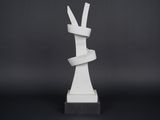 a white sculpture of a rabbit made out of paper on a black background