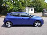 a picture of a blue car parked in a parking lot