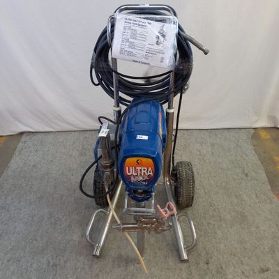 a blue machine that is sitting on the ground