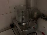 a blender sitting on a counter next to a bowl of food