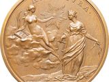 an image of a gold medal with a woman and a man on it