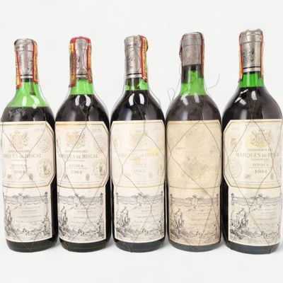 six bottles of wine are lined up in a row