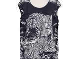 a black and white top with a leopard print on it