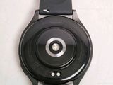 a close up of a smart watch on a white surface