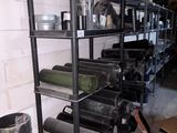 a shelf that has a lot of pots and pans on it