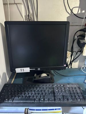 a computer on a desk with a keyboard and mouse
