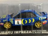 the subaru impreza rally car is in a clear display case