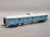 a blue train car that is sitting on the tracks