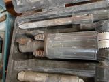 many tools in a case that are sitting on the floor