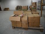 several boxes of food are stacked on a pallet in a warehouse