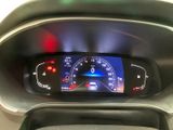 the dashboard of a car with a digital display on it