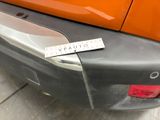 a sticker on the bumper of a car that has a sticker on it
