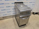 a stainless steel sink and a stove in a room