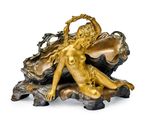 an image of a statue of a woman sitting on a clam shell